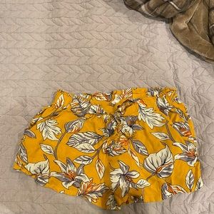 Yellow comfy shorts with flowers.